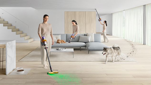 Dyson V15 Detect Absolute being used to clean floors, ceilings, and upholstery.